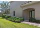 Well-maintained home featuring manicured landscaping, a brick walkway, and a welcoming front entrance at 2122 Bent Grass Ave, Ocoee, FL 34761