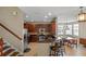 Elegant kitchen with stainless steel appliances, dark wood cabinets, and granite countertops at 2122 Bent Grass Ave, Ocoee, FL 34761