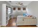 Cozy living room features custom built-in shelves with a comfortable sectional sofa at 2122 Bent Grass Ave, Ocoee, FL 34761