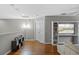 Open loft area with hardwood floors and built-in entertainment center at 2122 Bent Grass Ave, Ocoee, FL 34761