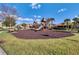 Community playground with slides, climbing structures, and a mulch ground cover at 2122 Bent Grass Ave, Ocoee, FL 34761
