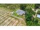Aerial view of a fenced home nestled next to open land at 2190 Northland Rd, Mount Dora, FL 32757