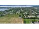 Beautiful aerial view of a home surrounded by expansive fields and a picturesque lake at 2190 Northland Rd, Mount Dora, FL 32757
