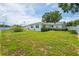 Lush backyard with well-maintained lawn, privacy fence, and cozy patio, great for entertaining at 2190 Northland Rd, Mount Dora, FL 32757