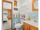 Charming bathroom with a classic blue tile design and wood accents at 2190 Northland Rd, Mount Dora, FL 32757