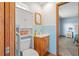 Bathroom featuring updated vanity, sink, and vintage medicine cabinet with tile backsplash at 2190 Northland Rd, Mount Dora, FL 32757