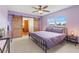 Stylish bedroom with an iron frame bed, sliding barn doors, and plenty of natural light at 2190 Northland Rd, Mount Dora, FL 32757