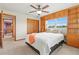 Comfortable bedroom with built-in shelving and a window view of the lush outdoors at 2190 Northland Rd, Mount Dora, FL 32757
