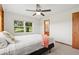 Bright bedroom featuring a ceiling fan, and a large window with natural light at 2190 Northland Rd, Mount Dora, FL 32757