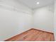 Walk-in closet with wood flooring and wire shelving; plenty of storage space at 2190 Northland Rd, Mount Dora, FL 32757
