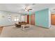 Inviting living room with neutral carpet, complemented by bright accent wall and offering a cozy space for relaxation at 2190 Northland Rd, Mount Dora, FL 32757