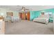 Expansive main bedroom suite featuring a bar, ensuite bathroom, and neutral tones for a tranquil retreat at 2190 Northland Rd, Mount Dora, FL 32757