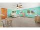 Spacious main bedroom boasts bright accents and multiple windows that bring natural light, plus ensuite and bar areas at 2190 Northland Rd, Mount Dora, FL 32757