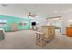 The main bedroom is spacious with a bar, and multiple windows provide beautiful light and refreshing outdoor views at 2190 Northland Rd, Mount Dora, FL 32757