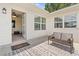 Inviting outdoor patio with stylish rug and comfortable seating, leading to a bright and airy interior at 2190 Northland Rd, Mount Dora, FL 32757
