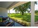 Inviting porch view with comfortable seating, lush greenery, and a picturesque vista of the expansive yard at 2190 Northland Rd, Mount Dora, FL 32757