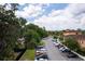 Aerial view showing the well-maintained neighborhood, street parking and surrounding landscape at 2662 Roadster Ln, Kissimmee, FL 34746