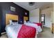 Bedroom with two twin beds, Lego decorations on the wall and light wood headboards at 2662 Roadster Ln, Kissimmee, FL 34746