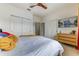 A bright bedroom with white walls, and a TV mounted on the wall, offering modern comfort at 2662 Roadster Ln, Kissimmee, FL 34746