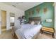 Bright bedroom with a decorative animal art, a comfortable bed, and tree design for a unique touch at 2662 Roadster Ln, Kissimmee, FL 34746