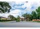 The Regal Oaks entrance is an attractive gate, with mature trees, and lush landscaping at 2662 Roadster Ln, Kissimmee, FL 34746