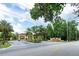 Elegant gated entrance to Regal Oaks, surrounded by lush landscaping and mature trees at 2662 Roadster Ln, Kissimmee, FL 34746