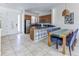 Spacious kitchen and dining area with stainless steel appliances and tile flooring at 2662 Roadster Ln, Kissimmee, FL 34746