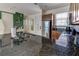Modern kitchen with granite countertops, tile flooring, and stainless steel refrigerator at 2662 Roadster Ln, Kissimmee, FL 34746