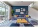 Bright living room with a comfortable sectional sofa and sliding glass doors to the outdoor area at 2662 Roadster Ln, Kissimmee, FL 34746