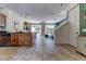 Bright living room with tile floors, and sliding glass doors to a screened patio at 2662 Roadster Ln, Kissimmee, FL 34746