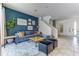 Comfortable living area that leads to a staircase and the front door at 2662 Roadster Ln, Kissimmee, FL 34746
