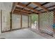 Enclosed back patio with lattice walls and concrete floor at 2942 N Chickasaw Trl, Orlando, FL 32817