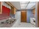 The kitchen features white cabinets, granite countertops, and stainless steel appliances at 2942 N Chickasaw Trl, Orlando, FL 32817