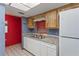 The kitchen features white cabinets, granite countertops, and stainless steel appliances at 2942 N Chickasaw Trl, Orlando, FL 32817