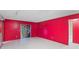 Tile-floored living room with patio access and bright wall color at 2942 N Chickasaw Trl, Orlando, FL 32817