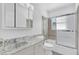 Bathroom featuring updated vanity and bathtub shower combo at 317 Benton St, Orlando, FL 32839