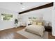 Serene bedroom featuring hardwood floors, neutral decor, and ample natural light at 317 Benton St, Orlando, FL 32839
