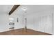 Bright bedroom with wood floors, beam accent, ensuite and spacious closet at 317 Benton St, Orlando, FL 32839