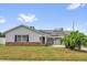 Charming home featuring solar panels, well-maintained lawn, and a brick facade at 317 Benton St, Orlando, FL 32839