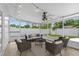 Relaxing screened patio offers comfortable seating and an overhead fan at 317 Benton St, Orlando, FL 32839