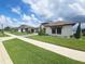 Beautiful home with a manicured lawn, tile roof, and lush landscaping, presenting an inviting curb appeal at 4073 Juliana Lake Dr, Auburndale, FL 33823