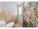 This bathroom features tile flooring, a shower, and a separate water closet at 5059 Jamaica Cir # 15, Orlando, FL 32808