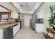 Bright kitchen features granite countertops, stainless steel appliances, and stone-look backsplash at 5059 Jamaica Cir # 15, Orlando, FL 32808