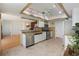 Updated kitchen featuring granite countertops, stainless steel appliances, and decorative lighting at 5059 Jamaica Cir # 15, Orlando, FL 32808