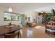 An open-concept space with a view into the kitchen and the dining room at 5059 Jamaica Cir # 15, Orlando, FL 32808