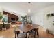 An open concept home with wood floors, a dining room, and a brown accent wall at 5059 Jamaica Cir # 15, Orlando, FL 32808