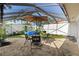 Outdoor patio area with seating, grill, above ground pool, and privacy fence at 5059 Jamaica Cir # 15, Orlando, FL 32808