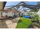 This screened patio area features seating, an above ground pool, and a privacy fence at 5059 Jamaica Cir # 15, Orlando, FL 32808