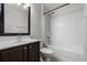 Bathroom featuring shower-tub combo, single sink, and neutral decor at 5671 Sycamore Canyon Dr, Kissimmee, FL 34758