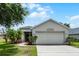 Charming single-story home features a well-maintained lawn and inviting curb appeal at 5671 Sycamore Canyon Dr, Kissimmee, FL 34758